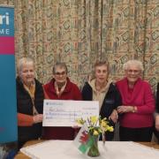 The Paul Sartori Foundation's first registered nurse, Carmel Gould, is pictured (centre) receiving the Eglwyswrw Village Association cheque from committee chair Mandy Phil,lips (left) and committee members Eileen Thomas, Tricia Fox and Mair Harries.