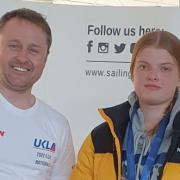 Tenby Sailing Club's Nina Marsh is pictured at the event  in Portland Harbour with one of the organisers.