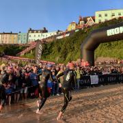 The Ironman Wales swim start at sunrise is one of the iconic moments of the event.