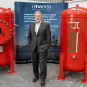 Neil Jenkins with the 1,000 litre hydrogen storage tanks. Picture: M Horwood/Creo International