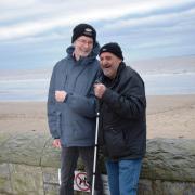 Alan, who has sight loss, looks forward to his regular beachside walks with Peter, a trained My Sighted Guide.