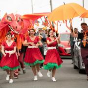 The Boogaloo Babes, Idris the dragon and Chase lead the Aberjazz Parade.