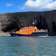 Tenby RNLI's volunteers were called out to attend reports of a person with a head injury and a stranded boat.