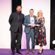 Wyn Davies (centre) receiving his award from Nick Knowles and FMB national president Jan Etchells.
