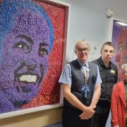 Nathan Wyburn (far right) created the images for the health board