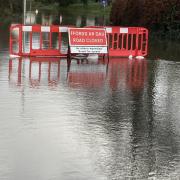 Police are urging drivers to abide by closed road signs on flooded streets