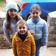 Youngsters, Hanna, Elsa and Beau, sing for calennig in the Gwaun Valley to celebrate Hen Galan.