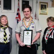 Iestyn (centre) with area commissioner Linda Wilson (L) and region commissioner Sue Benbow (right) celebrating his award