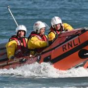 Tenby's inshore lifeboat was launched following reports of a person entering the water on Wednesday night.