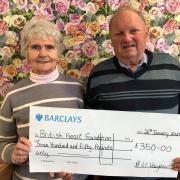 Bryn Vaughan and his wife Jean are pictured with the £350 cheque for BHF Cymru.