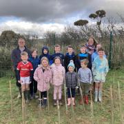 A number of children, including Rory's son and daughter, helped Ms Russell to plant the trees
