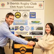 Thomas Coleman (chairman of St David's RFC) and Emma Bowen, general manager of Twr y Felin