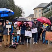 Stop the Stink campaigners braved the rain outside County Hall, Haverfordwest, today to demand that the problem is fixed.