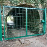 The secure gate at the 'short tunnel' entrance.