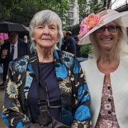 Solva Care founder Mollie Roach, left, and coordinator Lena Dixon on the right at the garden party at Buckingham Palace.