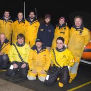Alex Ellis-Roswell is pictured with the RNLI crew from Fishguard lifeboat station.PICTURE: Johnny Morris