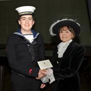 Liam Murphy receives his Young Persons Award from the High Sheriff of Dyfed, Mrs R E Jones.
