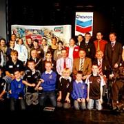 The Pembrokeshire Sport award winners and finalists proudly pose on the Follies Theatre stage.
