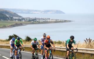The Tour of Britain cyclists riding from Aberaeron.