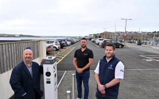 Councillor Rhys Sinnett, Andrew Mackay, and Gareth Phillips (L-R) at the newly resurfaced Mackerel Quay car park.