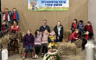 Youngsters from Ysgol Bro Ingli, Newport, are pictured with Pembrokeshire arable farmer Walter Simon.