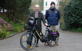 Cabinet member for residents’ services, Cllr Rhys Sinnett and Will Davies, council transport planner with the e-bikes that will soon be seen in Pembrokeshire.