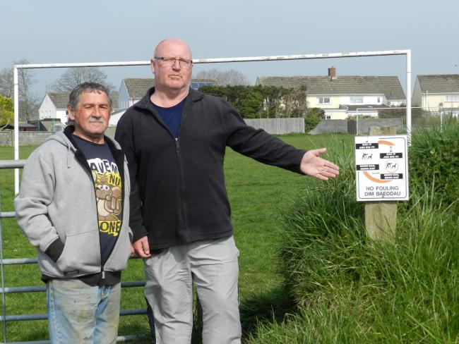 Slade Park residents Steve Evans (right) and Tony Dalton say a dog mess problem at their local playing field must be addressed. PICTURE: Western Telegraph  (23085367)
